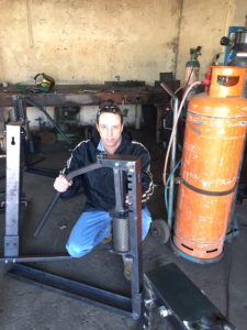 Kobus Venter, Director at Vuthisa with one of the Ratchet Presses ready for shipment.